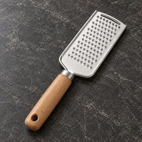 The exact grater resting diagonally on a stone worktop